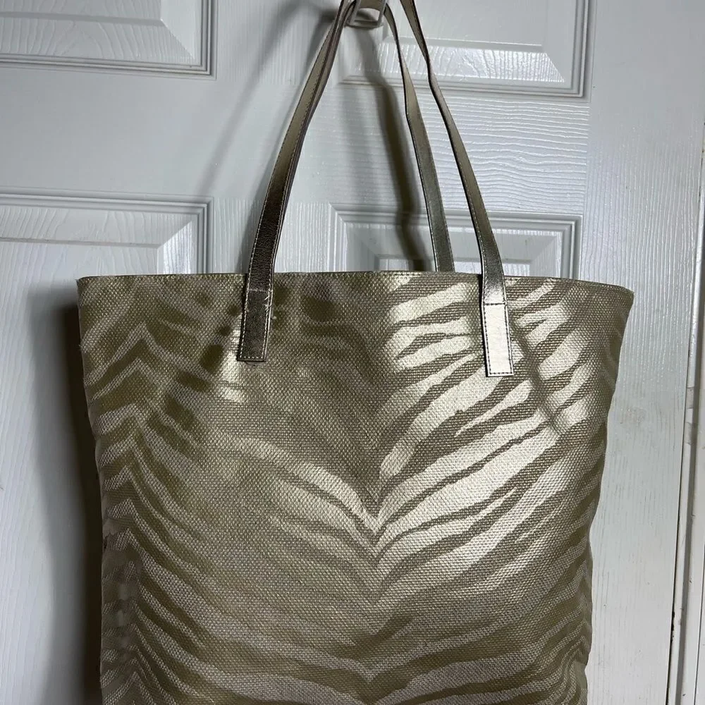 Michael Kors Metallic gold zebra print large tote gold tone hardwares and straps